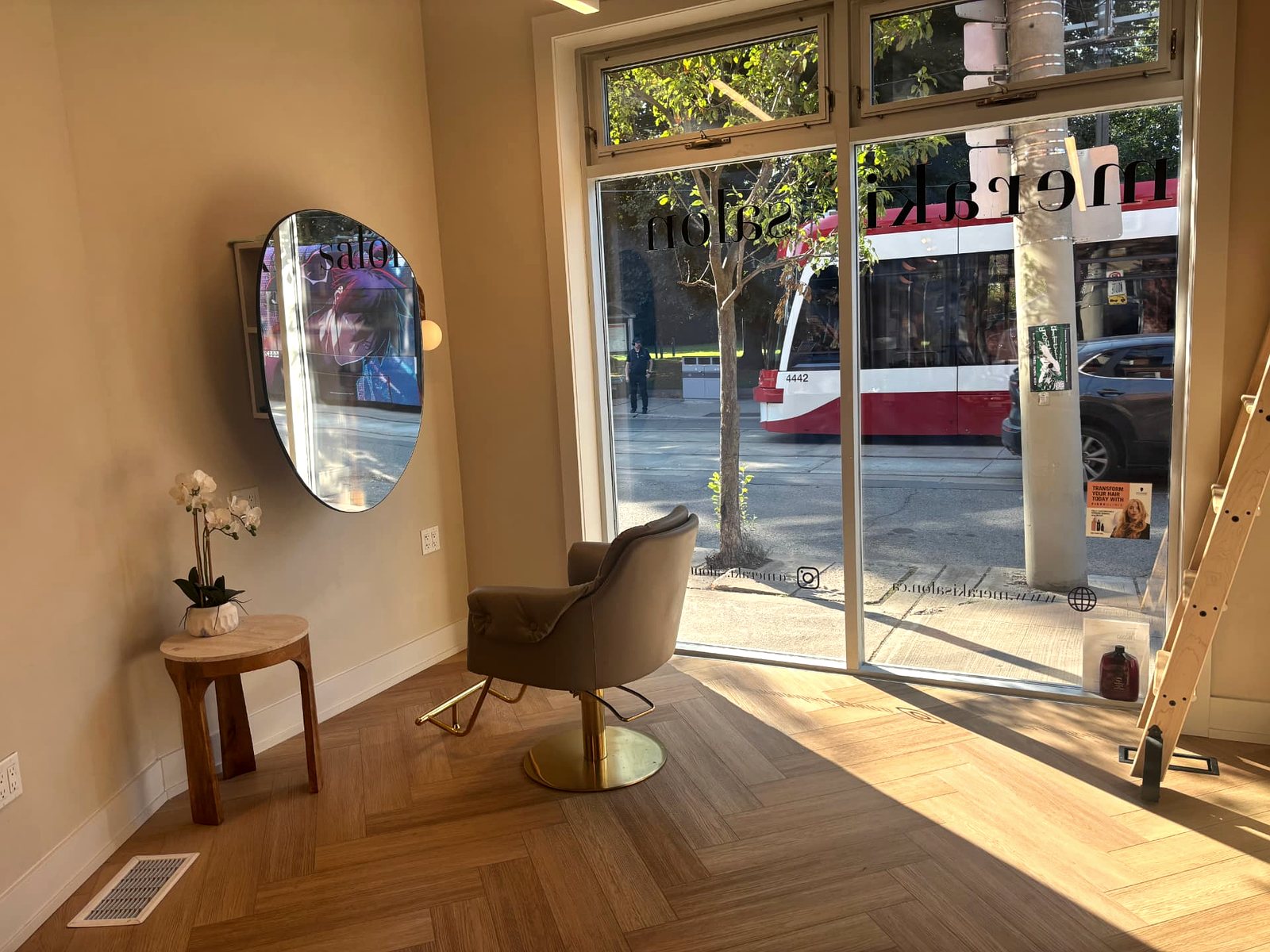 Marie's chair and mirror by the street-facing window inside Meraki Salon, King Street East, Toronto